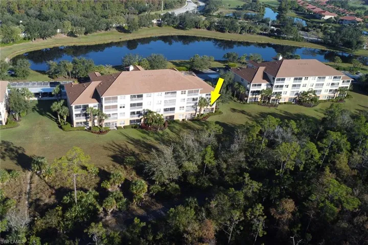 View of property location featuring a large body of water and apartment complex