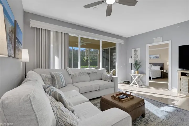 Living area featuring tile patterned flooring and baseboards
