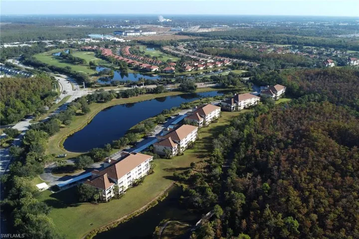 Aerial overview of property's location featuring a large body of water