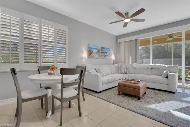 Living area with light tile patterned floors and baseboards