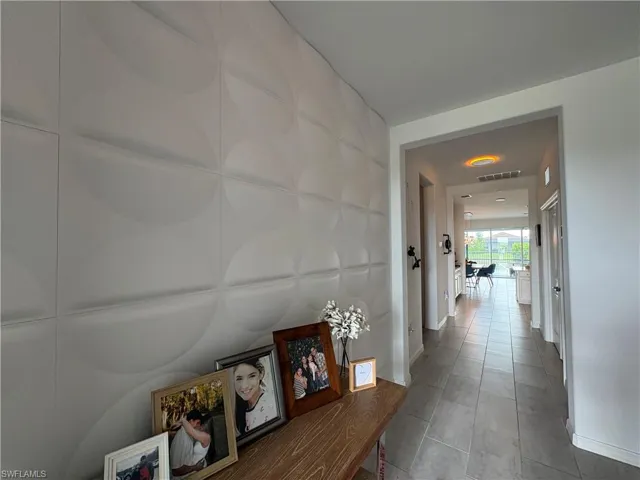 Textured accent wall featuring a modern circular pattern