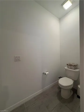 White toilet with ceramic tank