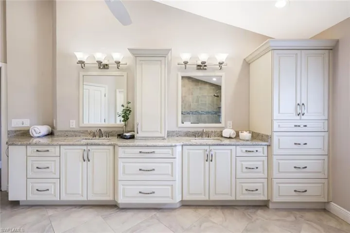 The Spacious Spa Bath Awaits! Raised Cabinetry, Amble Storage, Lovely Finishes, Porcelain Tile Floor