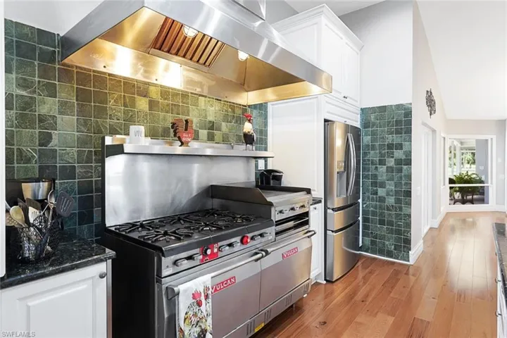 Go Big or Go Home! Commercial Grade Gas Vulcan, with 2 Ovens and a Griddle- Tiled Wall