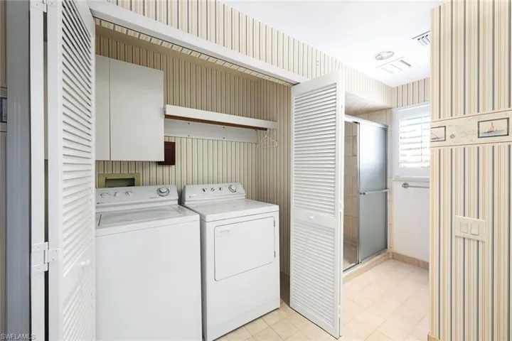 Second Floor Laundry Area with Full Size Washer and Dryer