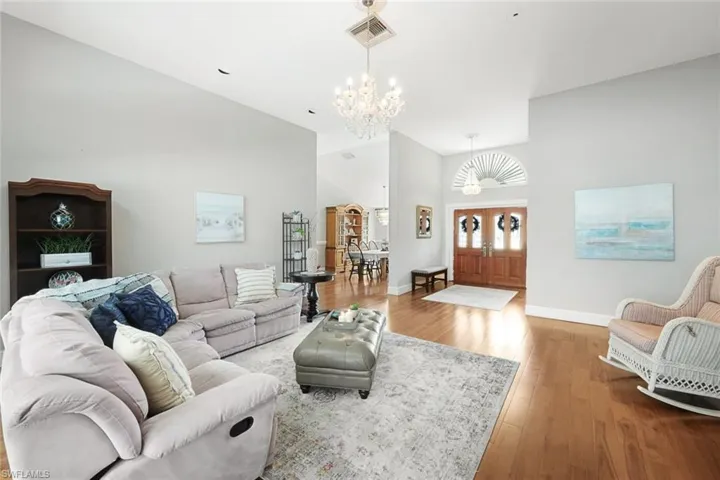 Living Room Showing Foyer and Dining Room- New Front Doors On Order
