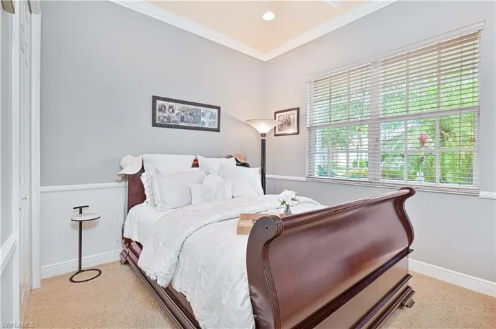 Bedroom with crown molding, light colored carpet, a ceiling fan, and recessed lighting
