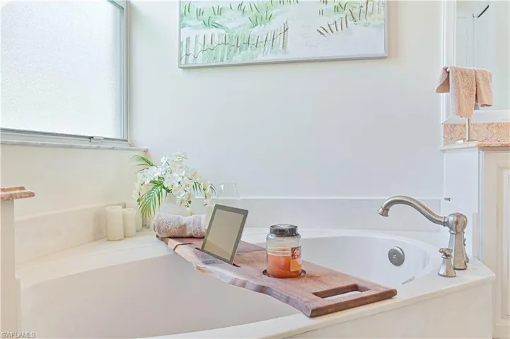Full bathroom featuring a garden tub