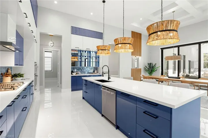 Offering dual-tone white cabinetry, high-end appliances, and an oversized butler’s pantry