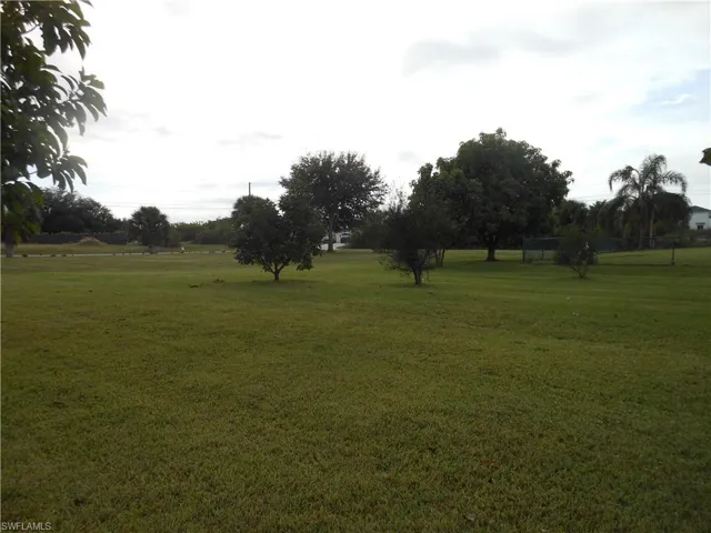 View of green lawn featuring a view of rural / pastoral area