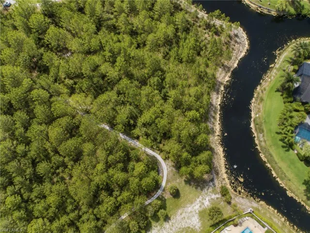Expansive wooded land parcel featuring a winding pathway