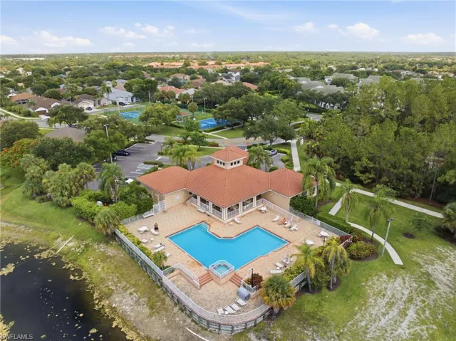 Community clubhouse featuring a swimming pool, spa, and sundeck