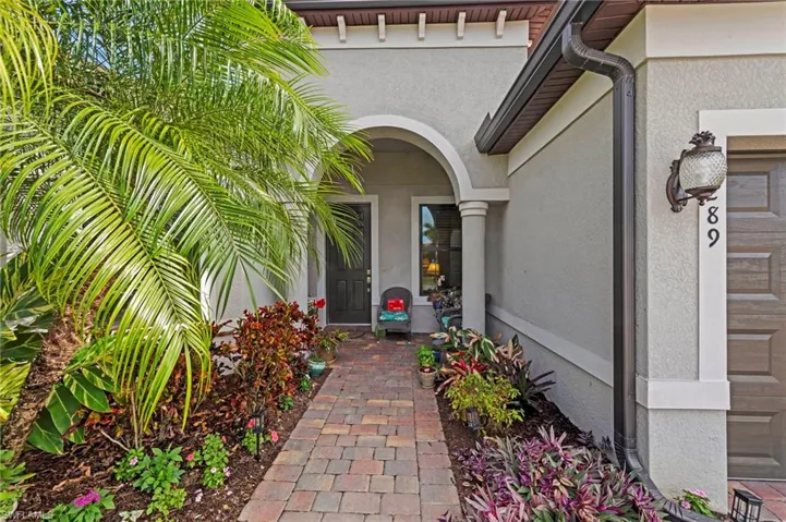 Doorway to property with stucco siding