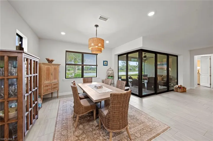 Dining space with recessed lighting and wood finish floors