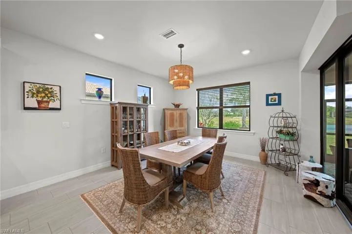 Dining space with healthy amount of natural light and recessed lighting