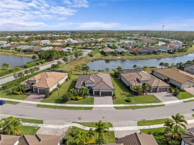 Aerial perspective of suburban area with a nearby body of water