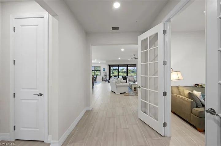 Hall with recessed lighting and french doors