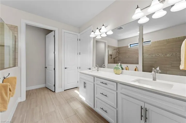 Bathroom with walk in shower and double vanity