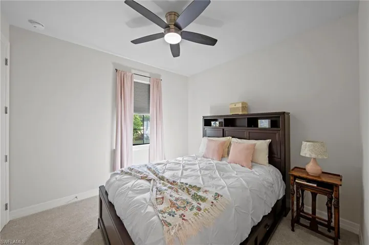 Bedroom featuring carpet flooring and ceiling fan