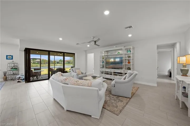 Living area featuring recessed lighting and ceiling fan