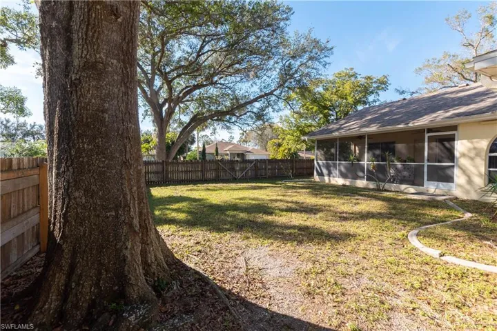 View of yard featuring a sunroom