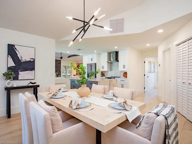 Dining area with light wood-plank tile finished floors and baseboards