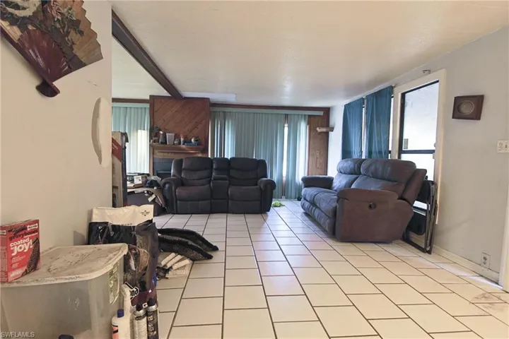 Living area with light tile patterned floors