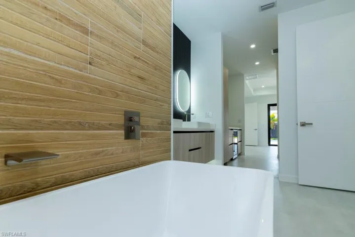 Walk in closet with a ceiling fan