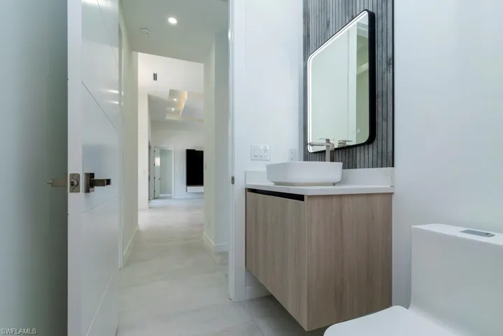 Unfurnished room with finished concrete floors, ceiling fan, and recessed lighting