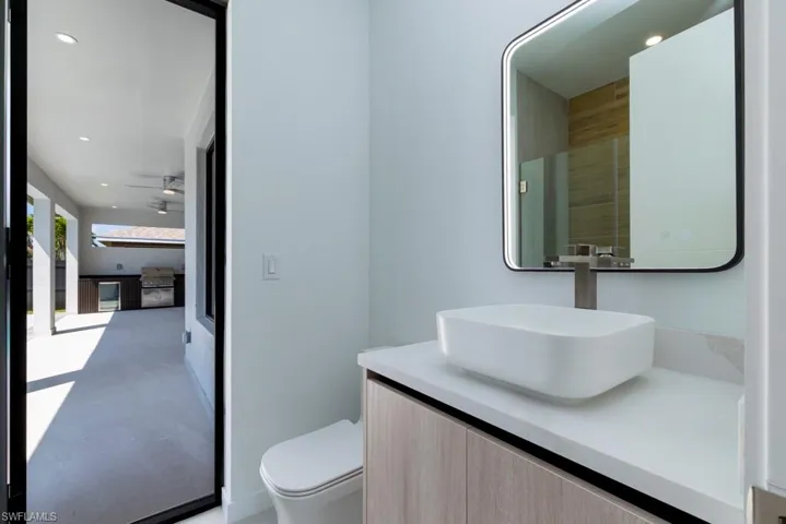 Full bath featuring vanity and a shower stall