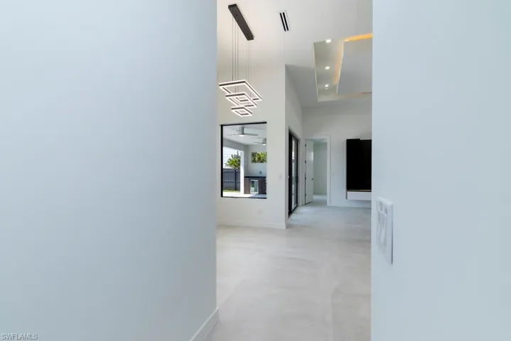 Full bathroom with wood walls, a walk in shower, a soaking tub, and plenty of natural light