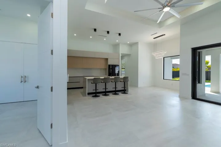 Spare room featuring recessed lighting and a high ceiling