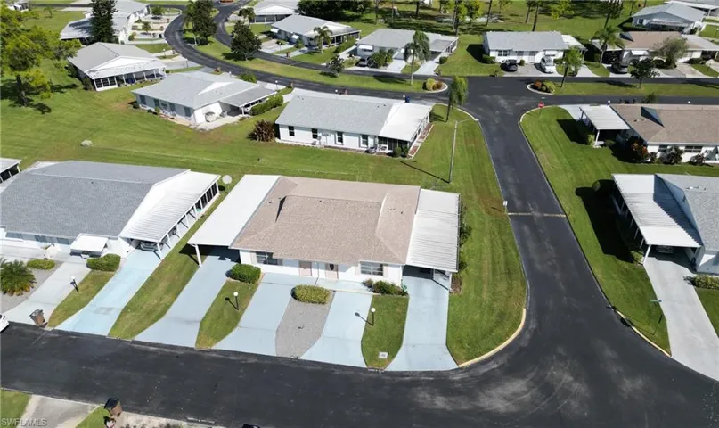 Aerial overview of property's location with nearby suburban area