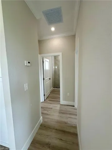 Full bath with double vanity, recessed lighting, wood finished floors, a shower, and a ceiling fan