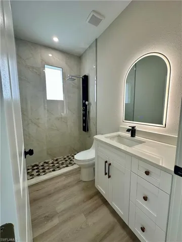 Corridor featuring crown molding and wood finished floors