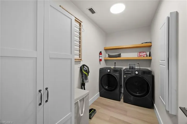 Spacious laundry room with extra storage space