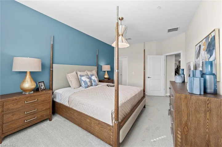 Bedroom with light carpet