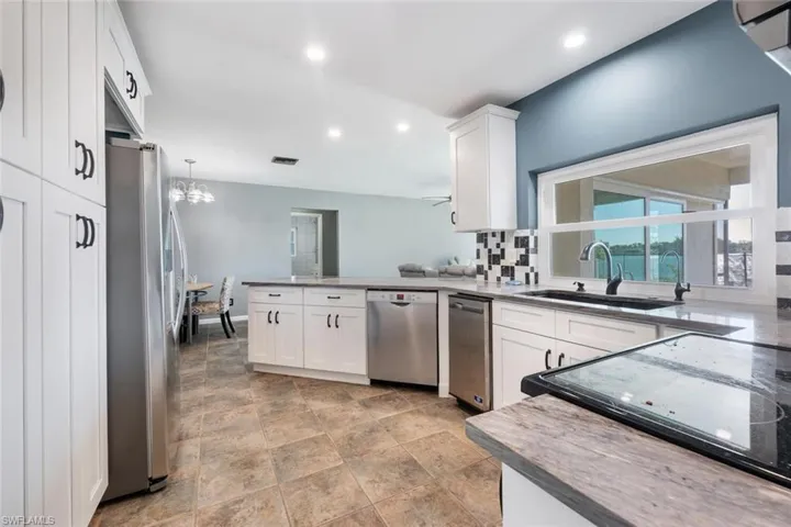 White shaker cabinetry and stainless steel appliances