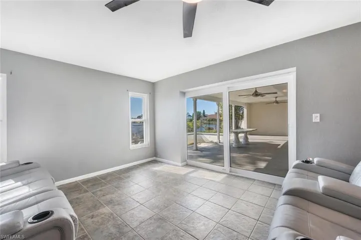 Sunny family room with slider to the lanai
