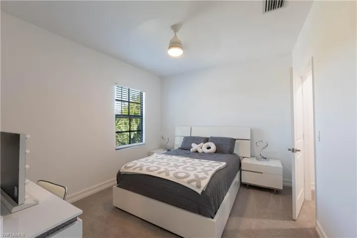 Bedroom with dark carpet
