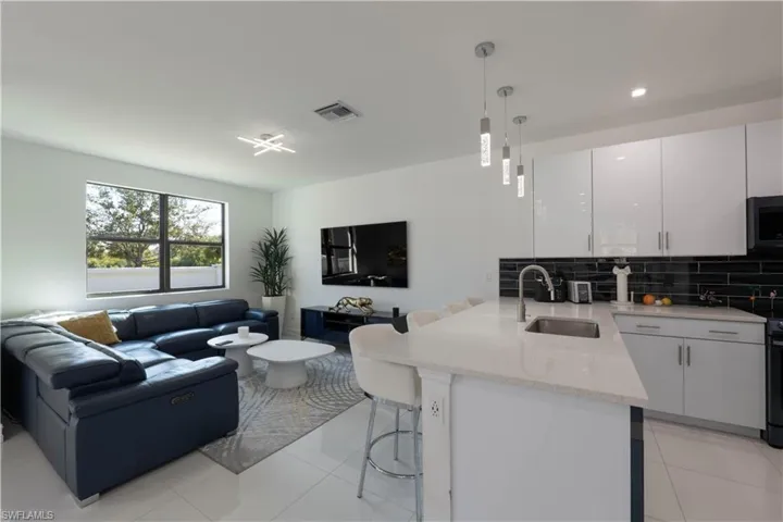 Living area with light tile patterned floors
