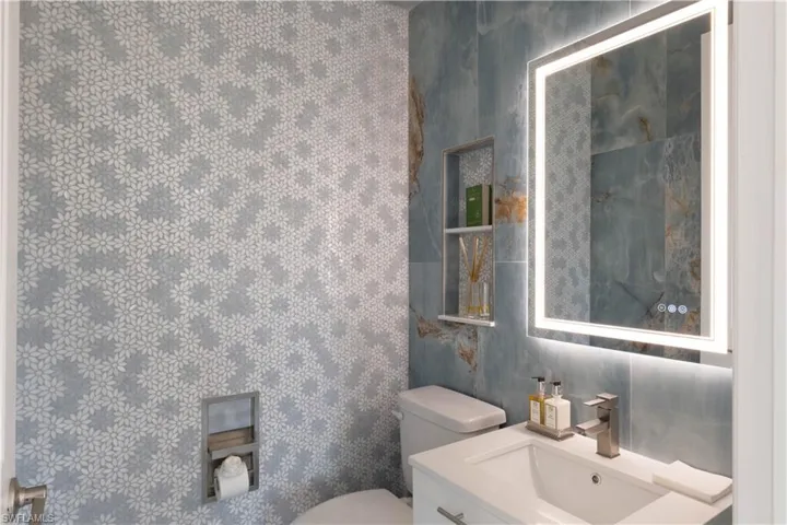 Bathroom featuring vanity and toilet