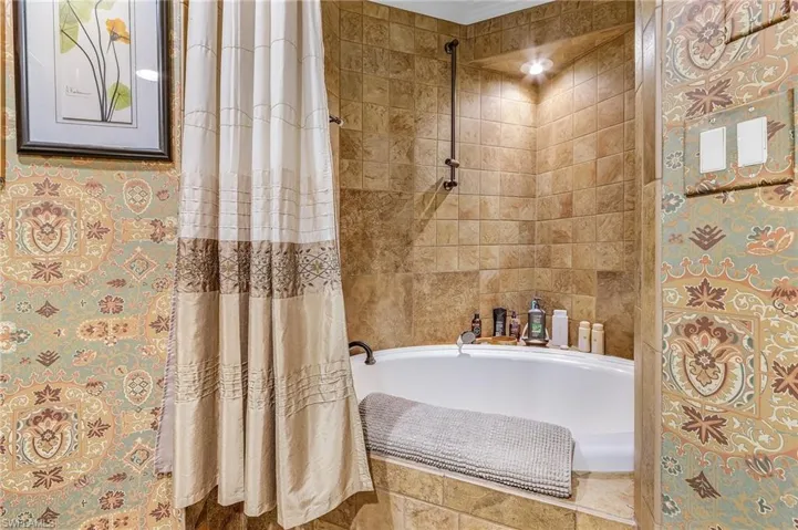 Full bath featuring tiled shower / bath