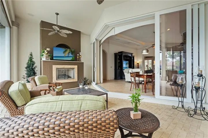 Living room with crown molding and ceiling fan