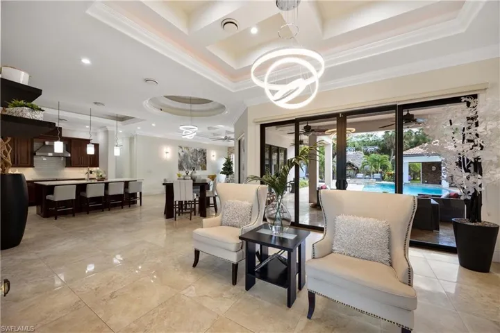 Building lobby with ornamental molding, coffered ceiling, and recessed lighting