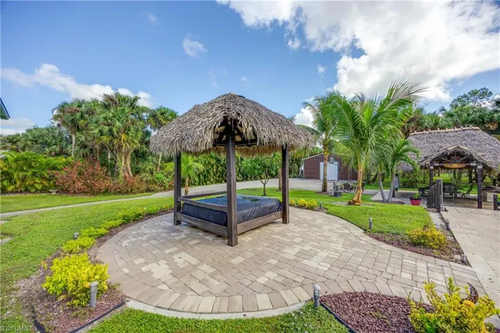 View of patio / terrace featuring an outdoor kitchen and beverage cooler