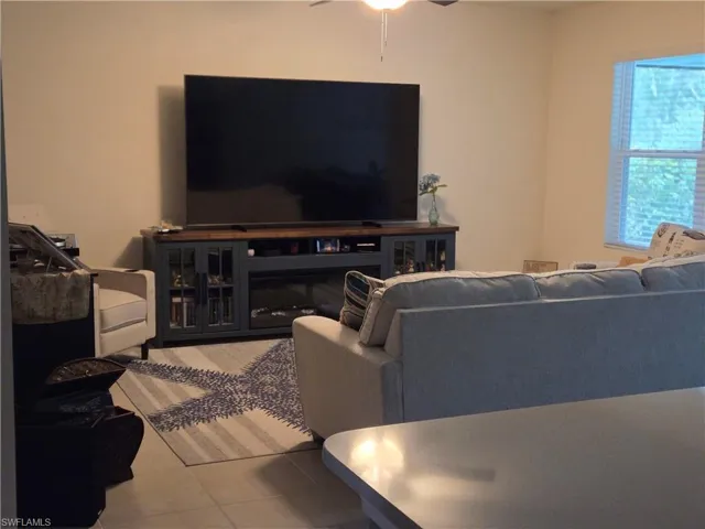 Tiled living area with ceiling fan