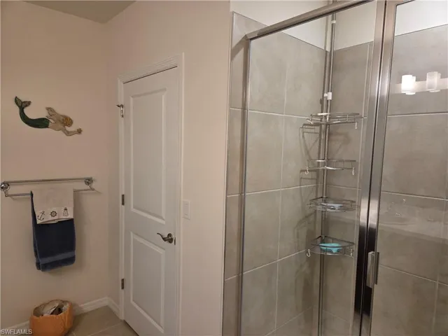 Full bath featuring a stall shower