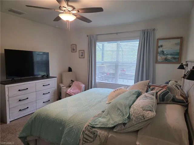 Bedroom featuring carpet flooring and ceiling fan