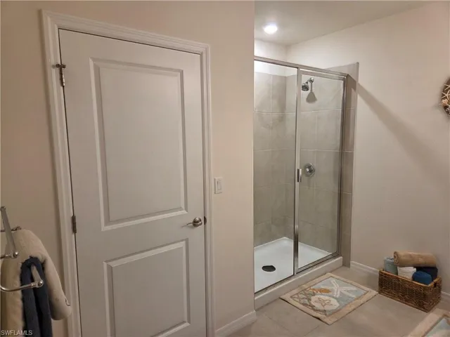 Master Bathroom featuring a stall shower and tile patterned floors